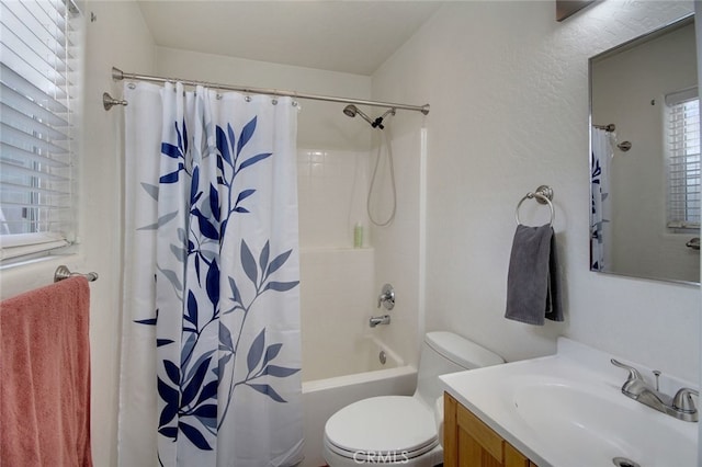 full bathroom with shower / bath combo with shower curtain, toilet, and vanity