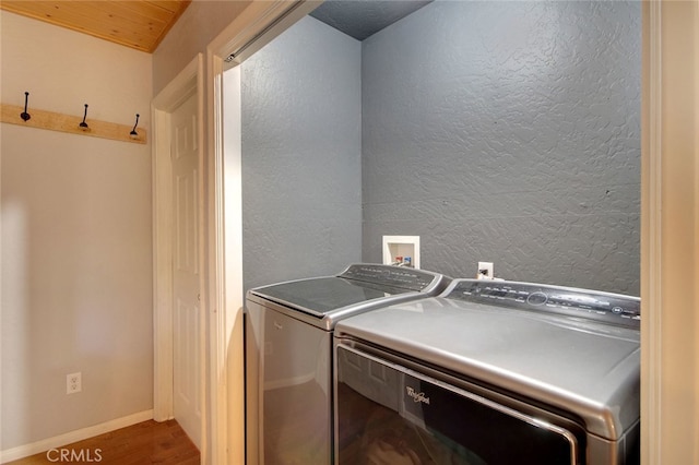 washroom featuring washer and dryer and hardwood / wood-style floors