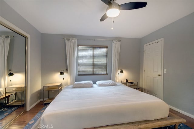 bedroom with ceiling fan and hardwood / wood-style floors