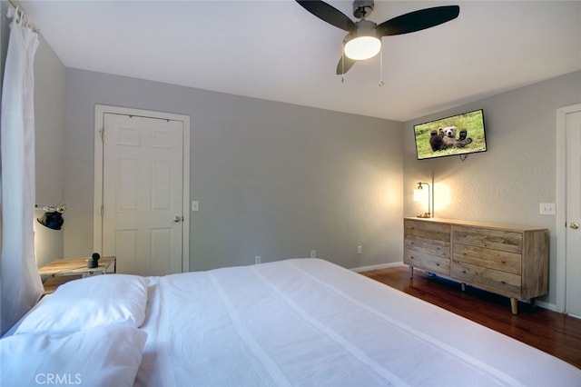 bedroom featuring ceiling fan and wood-type flooring