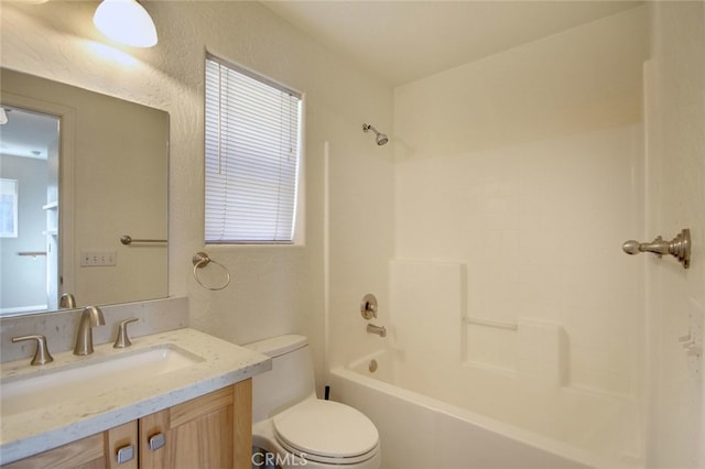 full bathroom with toilet, vanity, and bathtub / shower combination