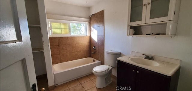 full bathroom with toilet, vanity, tile patterned floors, and tiled shower / bath