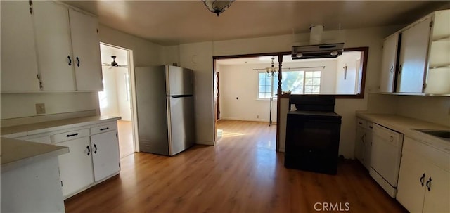 kitchen with stainless steel refrigerator, ceiling fan, dishwasher, light hardwood / wood-style floors, and white cabinets