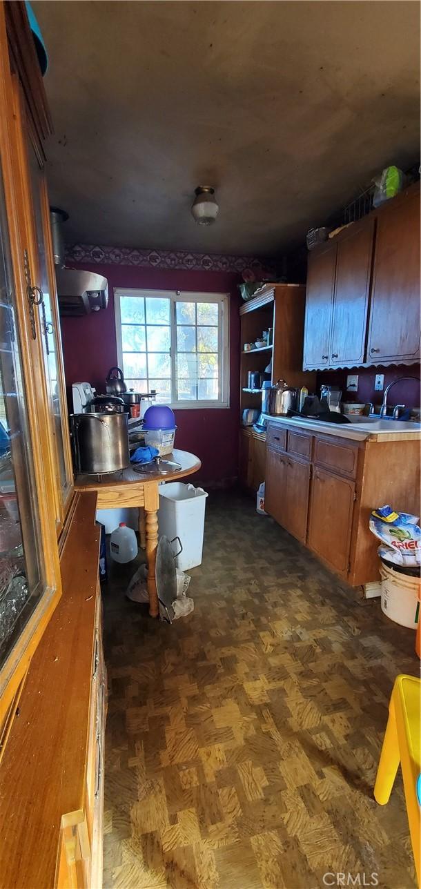 kitchen featuring dark parquet flooring