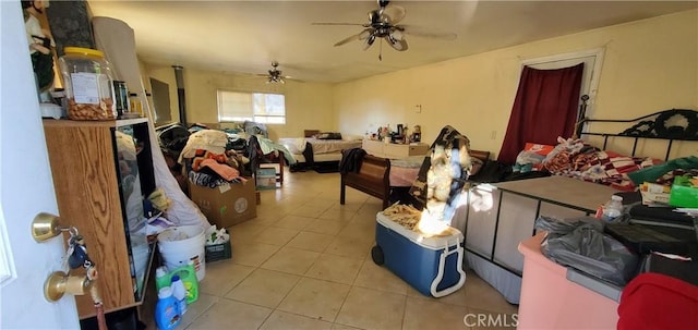 miscellaneous room featuring tile patterned floors and ceiling fan