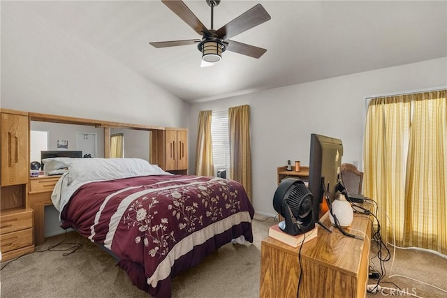 bedroom featuring ceiling fan, light colored carpet, and lofted ceiling