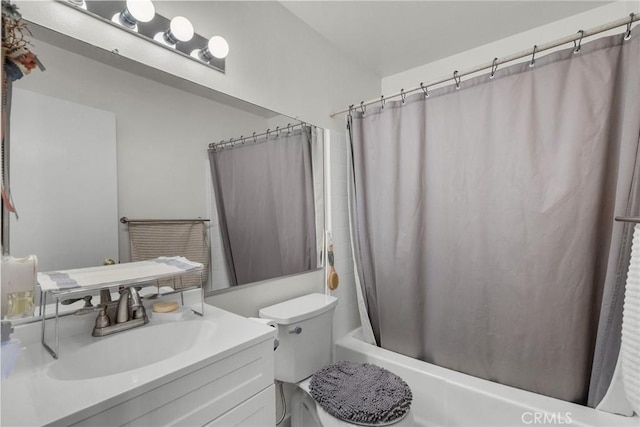 full bathroom with vanity, toilet, and shower / tub combo with curtain