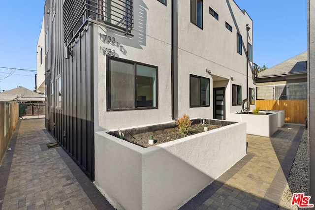 exterior space featuring a patio area and a balcony