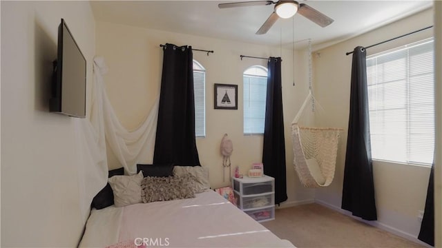 bedroom featuring ceiling fan and light colored carpet