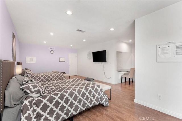 bedroom featuring wood-type flooring