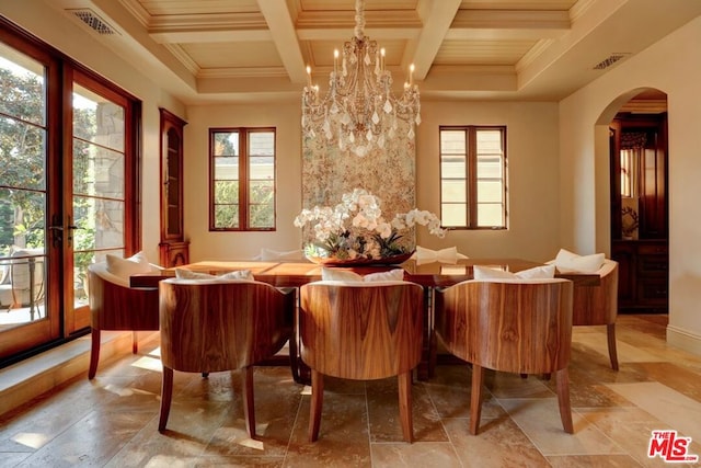 dining room with coffered ceiling, ornamental molding, beamed ceiling, and an inviting chandelier