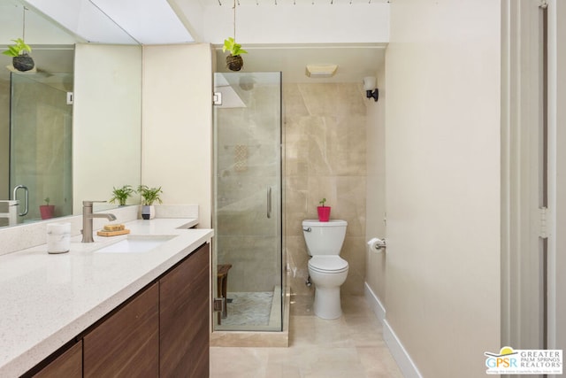 bathroom featuring tile patterned flooring, toilet, vanity, and walk in shower