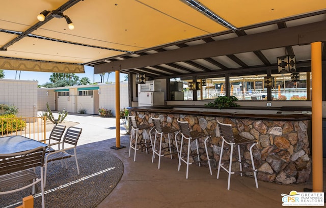 view of patio / terrace with a bar