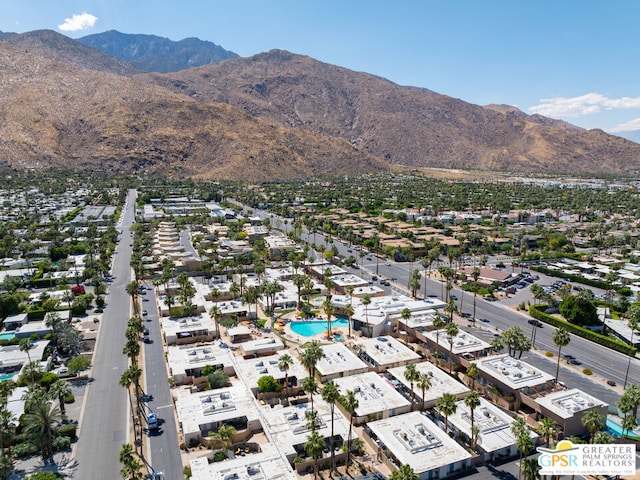 birds eye view of property with a mountain view