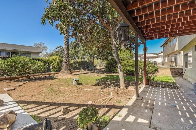 view of yard with a fenced backyard and a patio