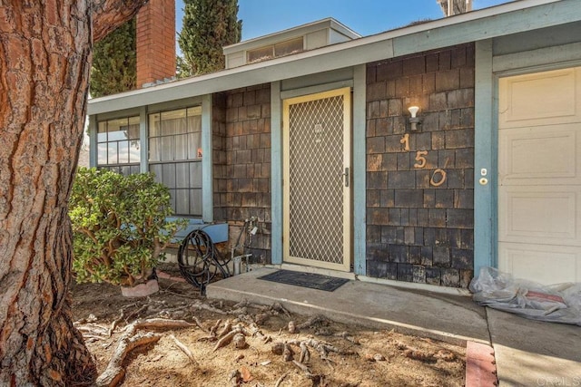 entrance to property featuring a chimney