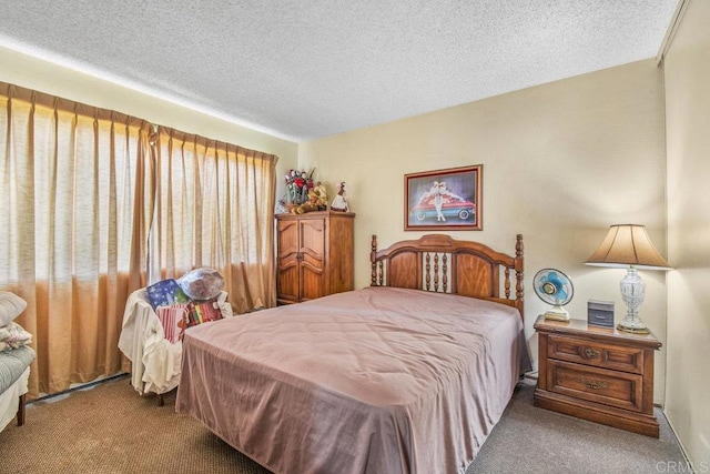 carpeted bedroom featuring a textured ceiling