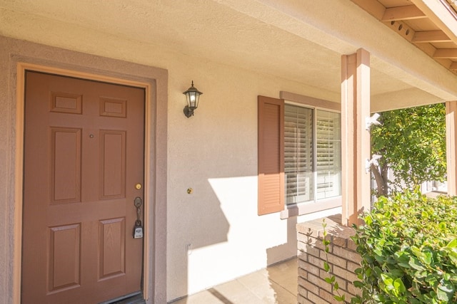 entrance to property with covered porch