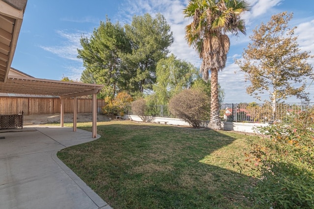 view of yard with a pergola and a patio area