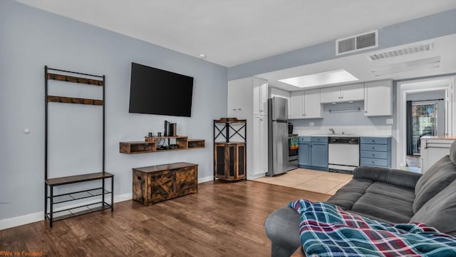 living room with light hardwood / wood-style floors