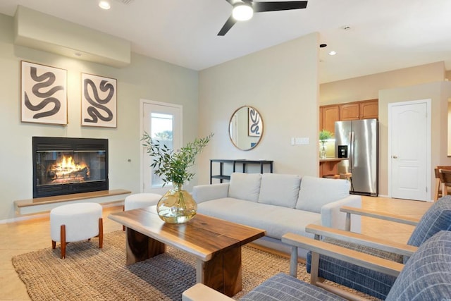 living room with light tile patterned floors and ceiling fan