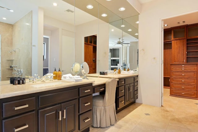 bathroom featuring tile patterned flooring, vanity, and ceiling fan