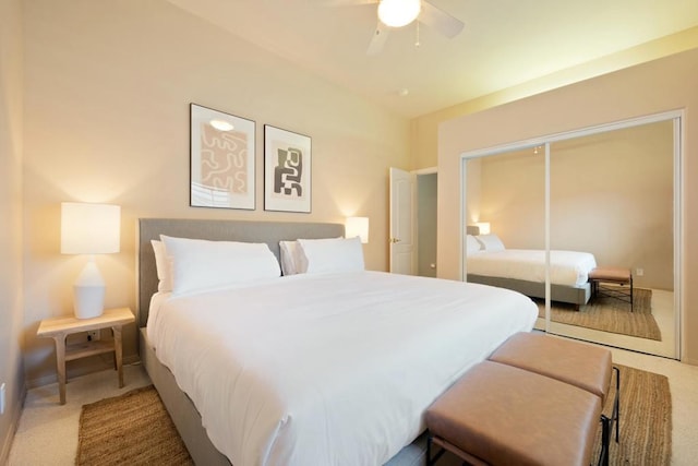 carpeted bedroom with ceiling fan and a closet