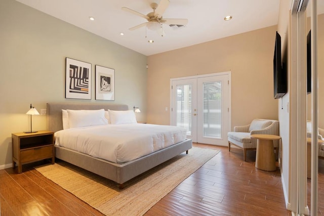 bedroom with access to exterior, french doors, hardwood / wood-style flooring, and ceiling fan