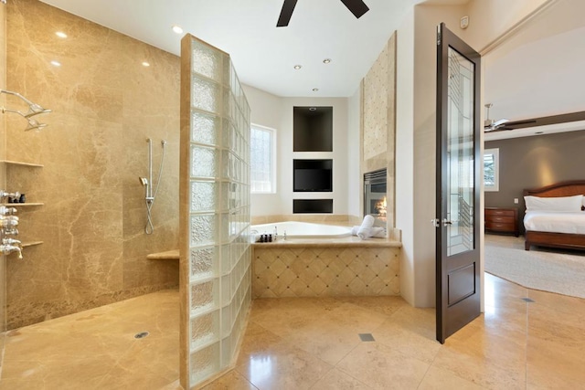 bathroom with tile patterned floors, built in shelves, a wealth of natural light, and shower with separate bathtub