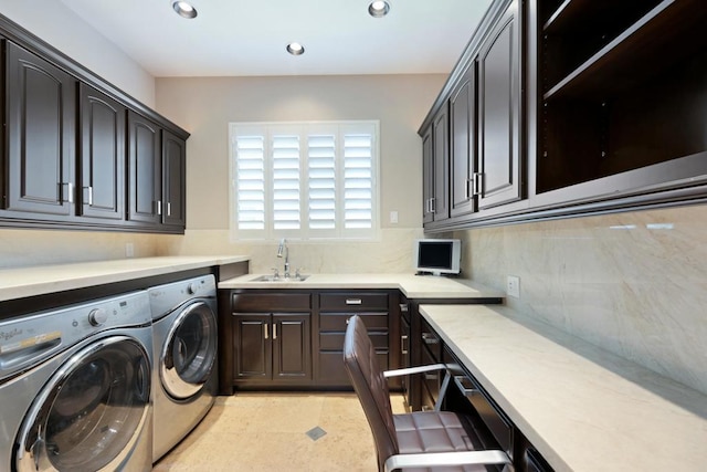 laundry room with cabinets, independent washer and dryer, light tile patterned flooring, and sink