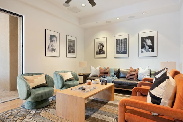 tiled living room featuring ceiling fan