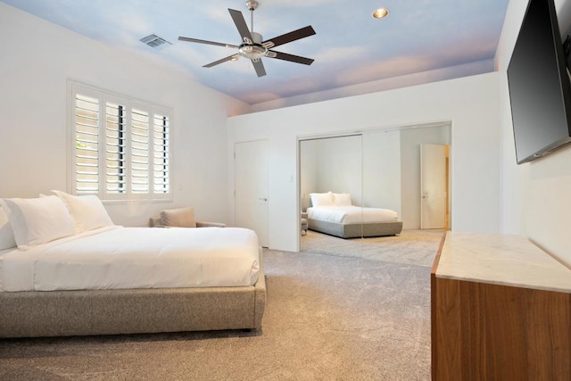 bedroom featuring carpet floors, a closet, and ceiling fan