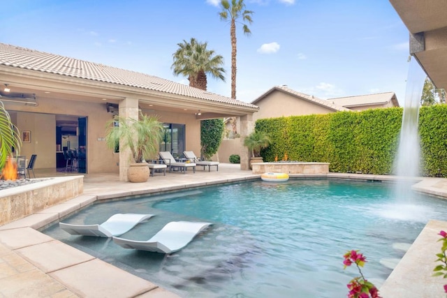 view of swimming pool with a patio area