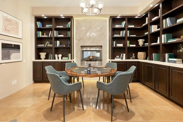 sitting room featuring light tile patterned floors and a notable chandelier