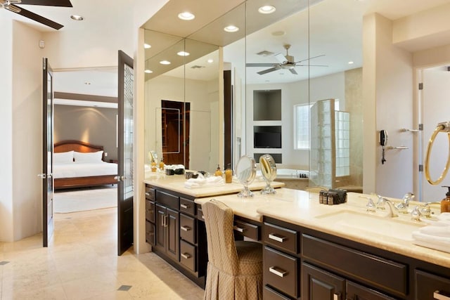 bathroom featuring tile patterned flooring, vanity, and ceiling fan