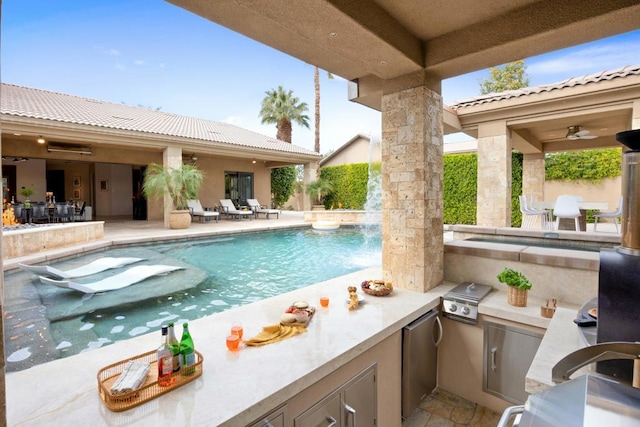 view of pool featuring area for grilling, a grill, and a patio