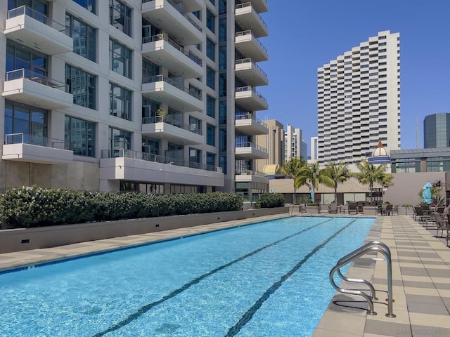 view of swimming pool featuring a patio area