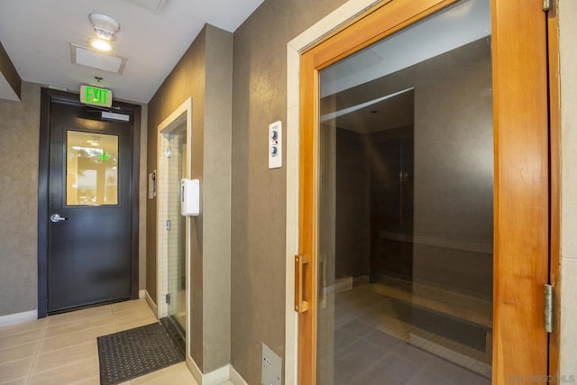 hallway featuring light tile patterned flooring