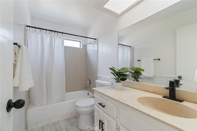 full bathroom featuring shower / tub combo, vanity, and toilet