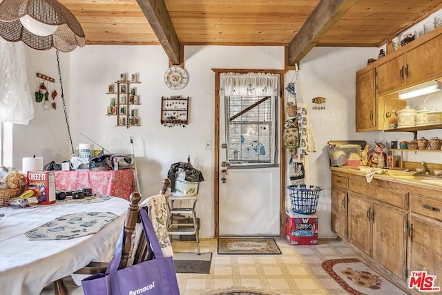 kitchen featuring beamed ceiling and wooden ceiling