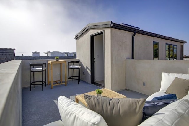 view of patio with a balcony