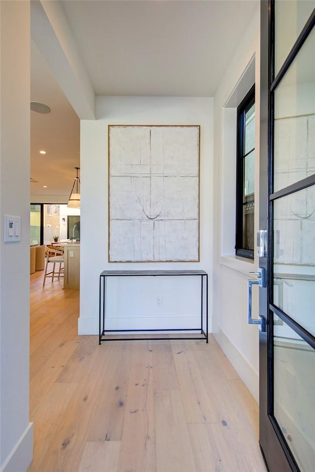 hall with light wood-type flooring