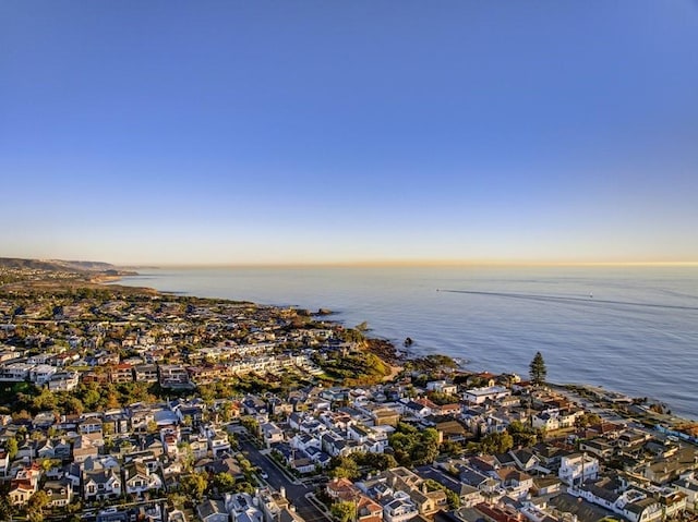 aerial view at dusk with a water view