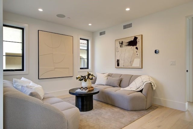 living room with light hardwood / wood-style flooring