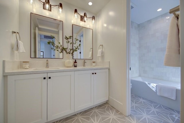 bathroom featuring toilet and vanity