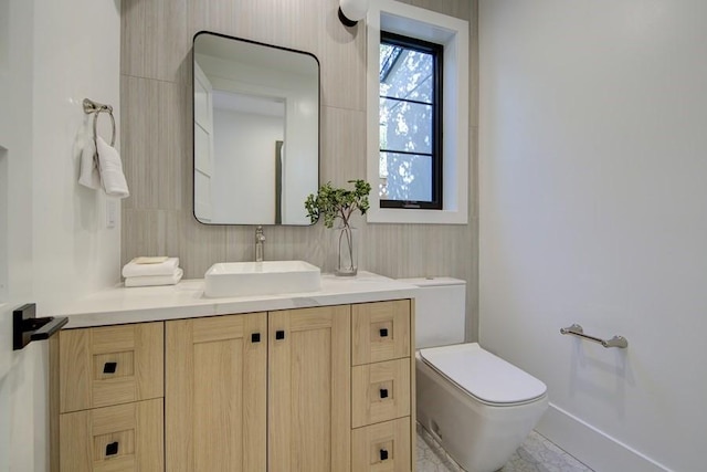 bathroom with toilet and vanity