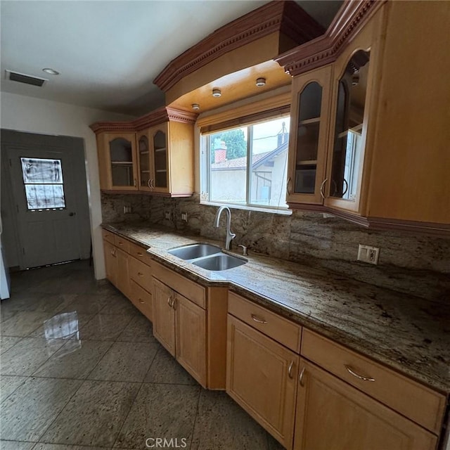 kitchen with backsplash and sink