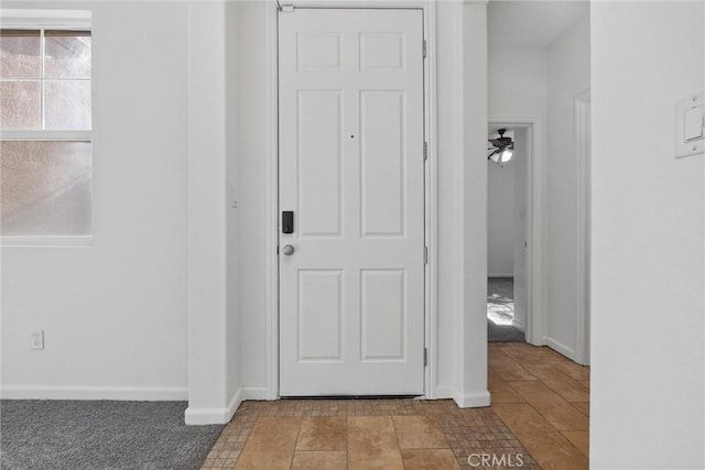 hall with light tile patterned flooring