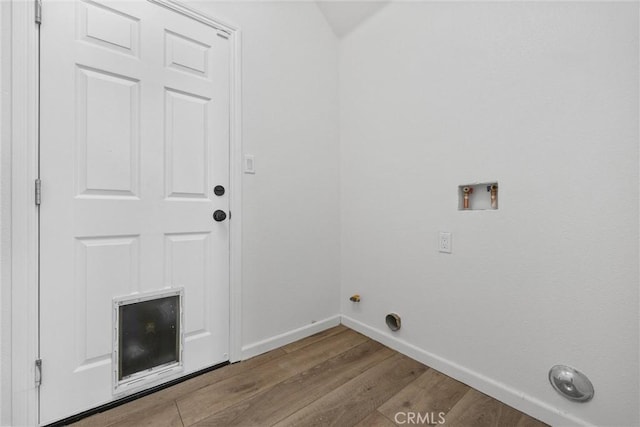 clothes washing area with hookup for a washing machine and light hardwood / wood-style floors