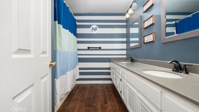 bathroom with hardwood / wood-style floors and vanity